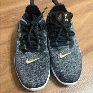Nike women’s Black and Yellow Flex Sneakers